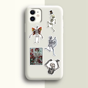 Detailed view of colorful skeleton and rose art prints on a white smartphone case
