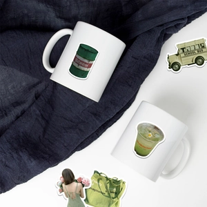 Detail of waterproof avocado green stickers applied to a white ceramic mug for decoration