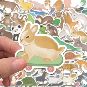 Close-up of a cartoon bunny on a skateboard sticker with assorted animal decals background