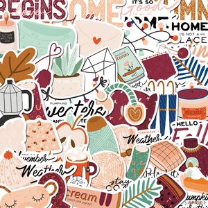 Detail of autumn-themed stickers featuring cozy candles, sweaters, and fall quotes