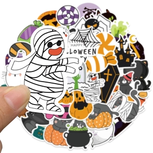 Close-up of hand-held cartoon mummy sticker from Halloween decoration set