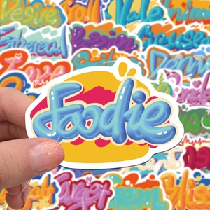 Close-up of Foodie 3D graffiti sticker on a laptop with vibrant waterproof PVC material