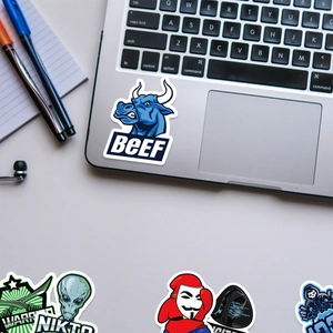 Waterproof hacker-themed vinyl graffiti stickers set on a silver laptop surface