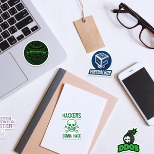 Flat lay of waterproof hacker stickers including VirtualBox logo and system failure design