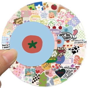 Close-up of decorative floral and cartoon stickers for stationery and journals