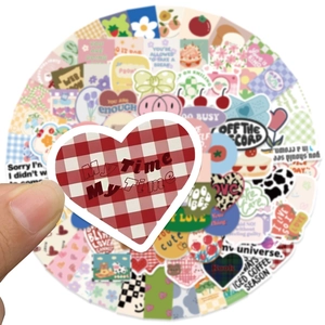 Close-up of heart-shaped checkered sticker for scrapbooking and creative decoration