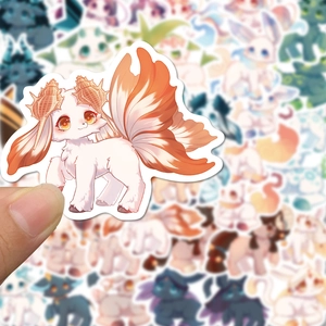 Close-up of a cute fantasy creature sticker with multiple tails for scrapbook decoration