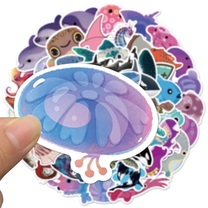 Detailed close-up showing cute waterproof PVC ocean life stickers being held by hand