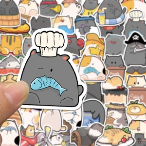 Close-up of cute cartoon cat stickers for planners and suitcases with waterproof details