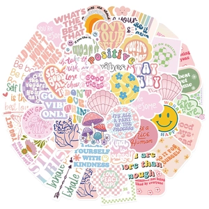 Close-up of Danish style aesthetic stickers with positive quotes and pastel illustrations