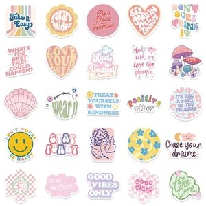 Close-up of 25 colorful Danish pastel stickers with motivational quotes on a white background