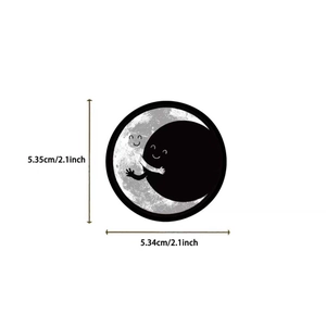 Macro detail of gothic sun and moon stickers with precise 5.3cm dimension markings