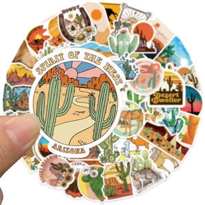 Close-up of matte desert stickers with vintage cactus and camel designs for luggage