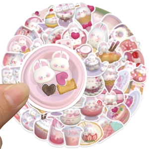 Detail of 3D pink bunny dessert stickers featuring sweet cakes and cookies