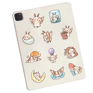 Close-up of cute cartoon moth stickers applied on a white tablet for decoration