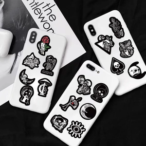Black and white gothic vinyl stickers showing skulls and roses on white phone cases