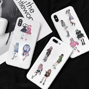 Detailed view of aesthetic anime girl stickers applied on the back of white smartphones