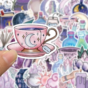 Detail of pink tea cup sticker with gold stars and crescent moon on astrology theme decal