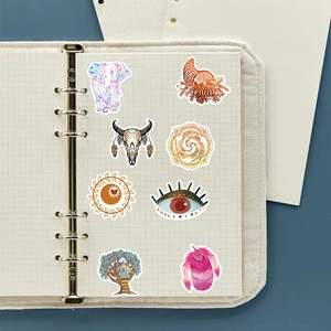 Detail of BOHO style waterproof PVC stickers applied on a grid notebook for decoration