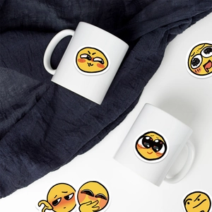 Funny emoji stickers displayed on a white ceramic mug with a creative blue background