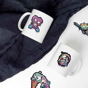 Detail of purple gothic graffiti stickers featuring skull and heart on white ceramic mugs