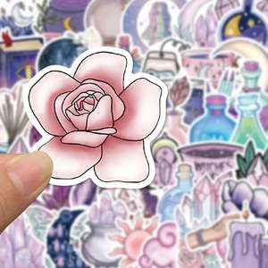 Close-up of pink rose sticker with purple magic moon and witchy theme elements stickers