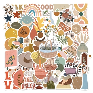 Detailed flat lay of waterproof Boho art stickers featuring rainbow and sun motifs