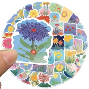 Close-up of a floral sticker being held to show size and colorful botanical details