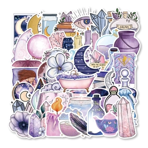 Detail of mystical purple magic moon stickers with hand-drawn crystals and fantasy motifs