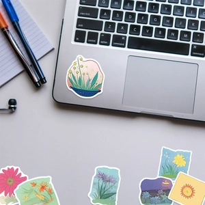 Floral stickers used for decorating laptop hand rest in a neat workspace setup