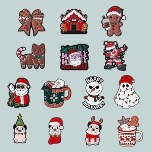 Set of 13 creative Christmas enamel pins featuring gingerbread man and Santa Claus designs