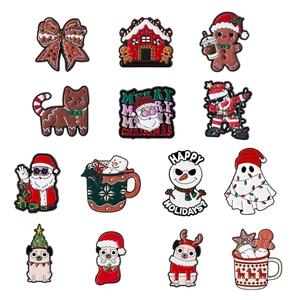 Set of 13 Christmas enamel pins featuring Santa Claus, gingerbread man and snowman designs