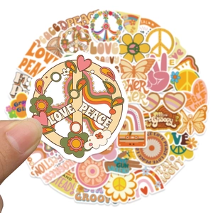 Close-up of a vintage BOHO hippie sticker set featuring a peace sign and retro flower patterns