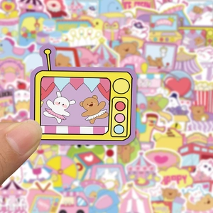 Close-up of cute cartoon bear stickers for planners, featuring a colorful TV set design