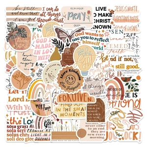 Flat lay of boho aesthetic PVC waterproof stickers with Christian faith quotes and motifs