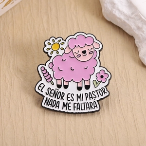 Cute pink sheep enamel brooch with flowers and Spanish religious scripture on fabric