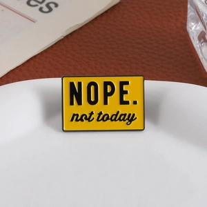Creative yellow enamel pin with black NOPE. not today text for bags and apparel