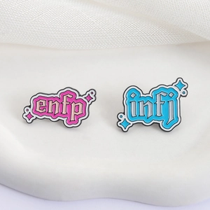 Cute MBTI enamel pins for ENFP and INFJ styles with gothic font and star accents