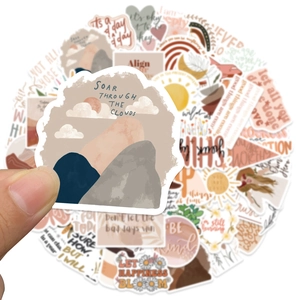 Close-up of waterproof BOHO style stickers with inspirational quotes and natural patterns