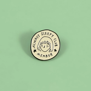 Cute Always Sleepy Club Member enamel pin badge on a light green background