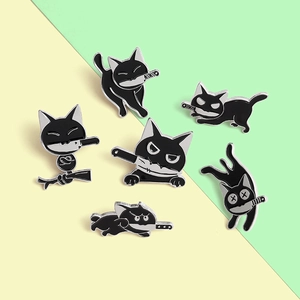Macro shot of 6 creative black cat enamel pins with funny knife-wielding designs