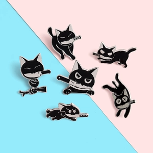Detail showing a set of six cute black cat enamel pins with daggers on a split background