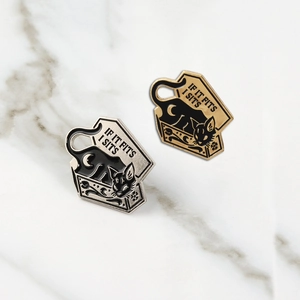 Punk black cat in box enamel pins with IF IT FITS I SITS text on marble background