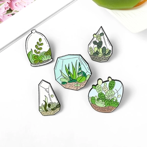Set of creative enamel plant pins featuring cacti and succulents in glass terrariums