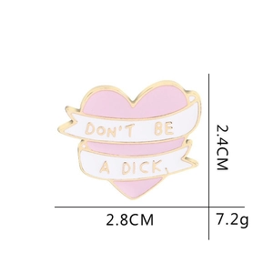 Pink heart enamel pin with Don't Be A Dick slogan banner, 2.8cm wide alloy badge