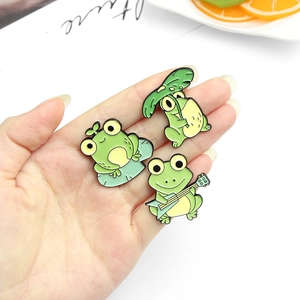 Cute enamel frog pin set featuring guitar playing and strawberry designs for accessories