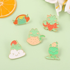 Cartoon frog enamel pins set with strawberry and rainbow designs for clothing decor