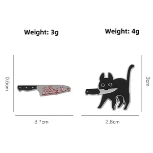 Detail view of cartoon cat with knife enamel pin and Killing It knife badge with dimensions