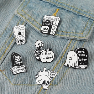 6-piece creative punk skull enamel pins set on blue denim fabric background