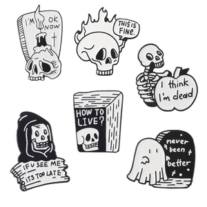 Set of six punk skull and ghost enamel pins with dark humor slogans on white background